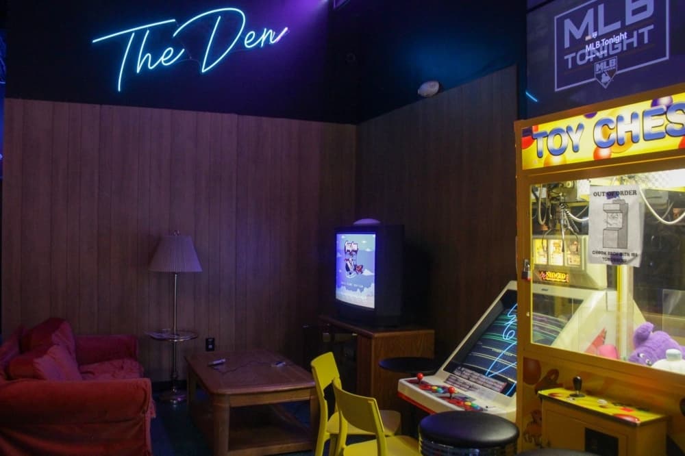 Pixel Palace Arcade and Bar blends together a variety of details from the '70s, '80s and '90s to create a nostalgic experience, including the wood paneling in The Den area. (Dacia Garcia/Community Impact)