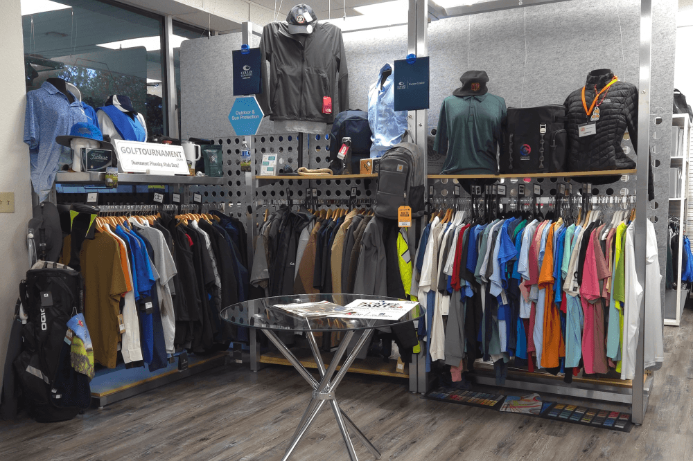custom t-shirts hanging on clothing rack