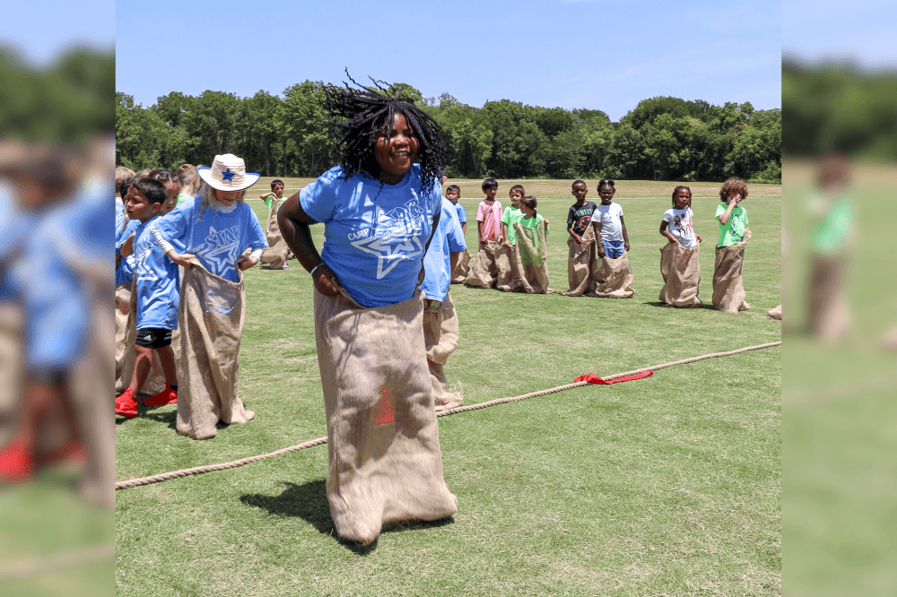 child hopping in a sack race