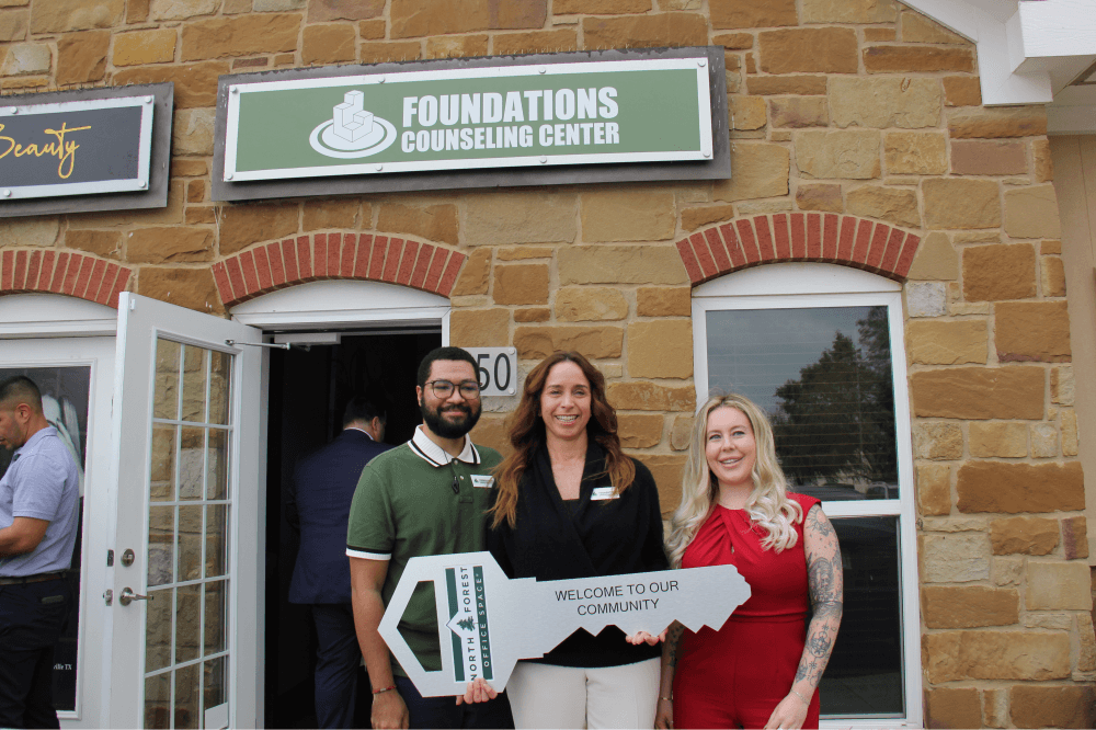 Foundations Counseling Center team with key at ribbon cutting