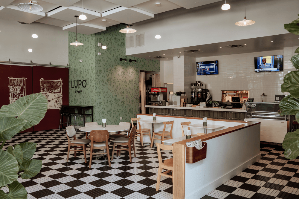 Interior seating and café space at Lupo in Generation Park Houston offering coffee, breakfast, and casual dining near Lake Houston Parkway