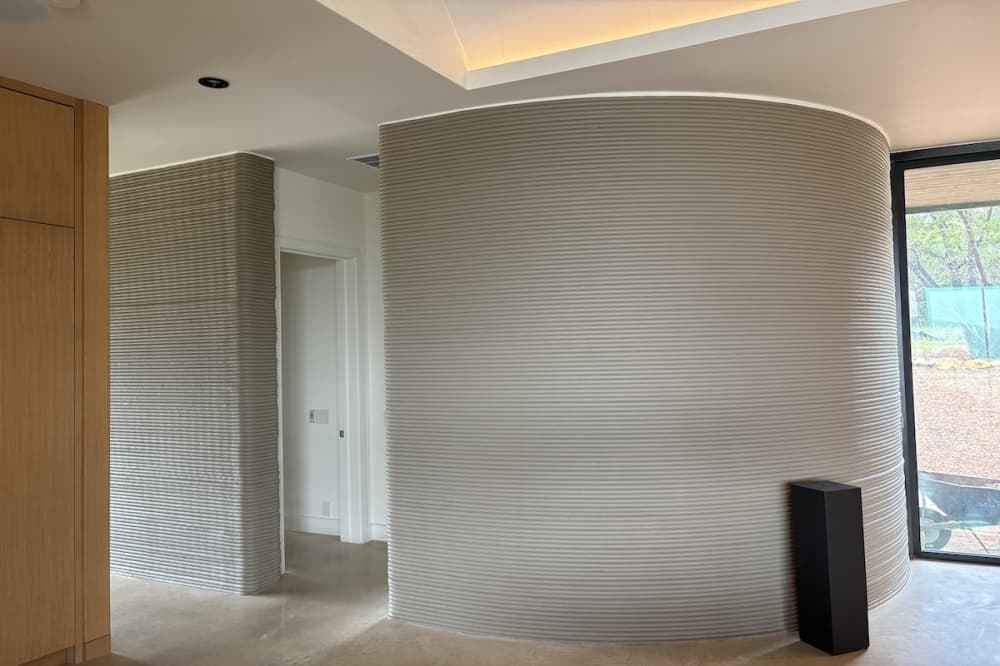 Exterior of one of the four 3D-printed quadrants in each 3400-square-foot home at The Canyon Club. 