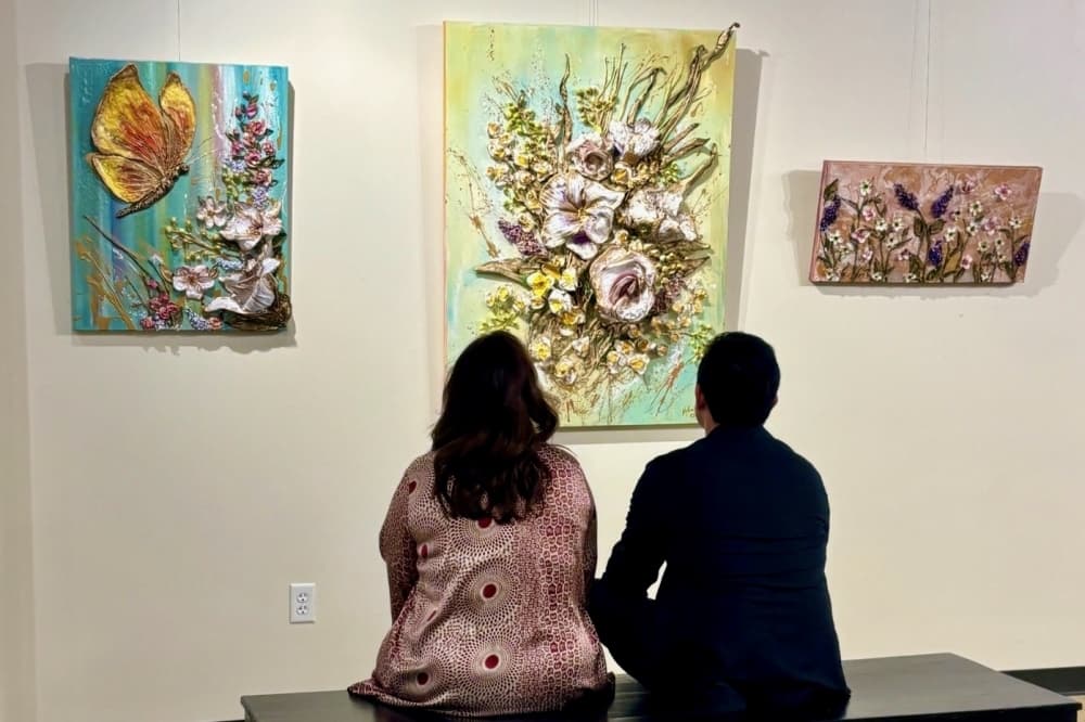 People sitting in an art gallery