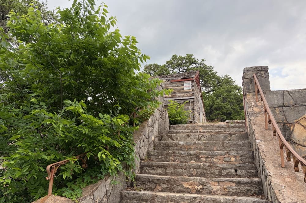 A shot of stairs leading up to the John M. King Log House.