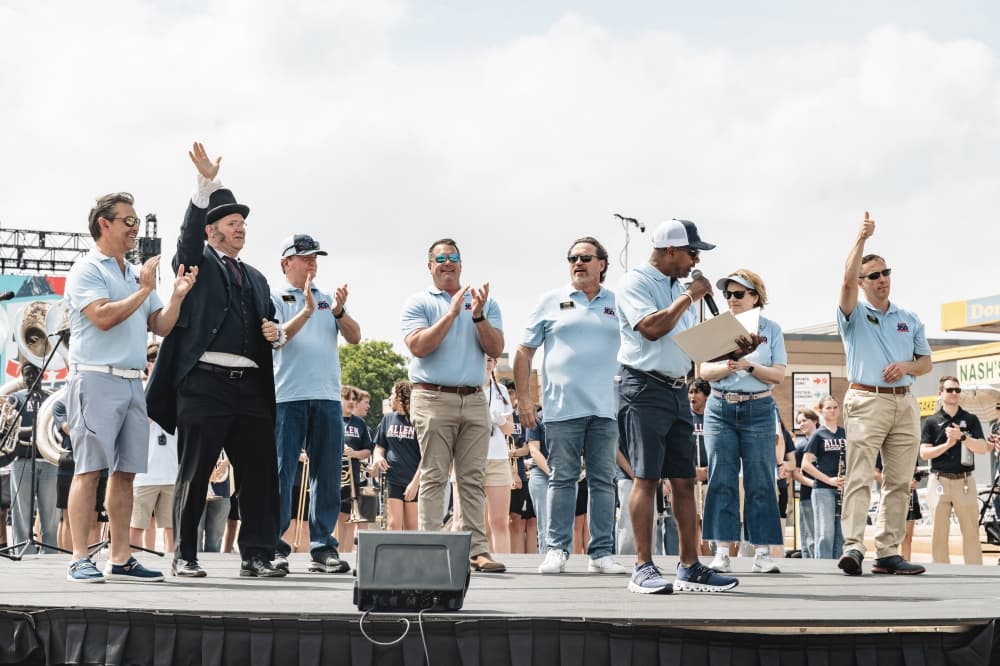 people standing on a stage at the event