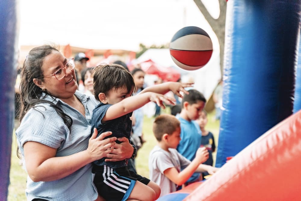 a kid throwing a basketball