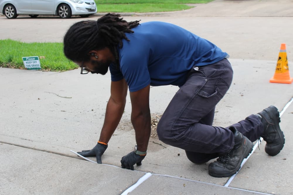 Hands for Hire staff are trained in a variety of home improvement services such as driveway repairs and other home improvements. (Ariel Worthy/Community Impact)