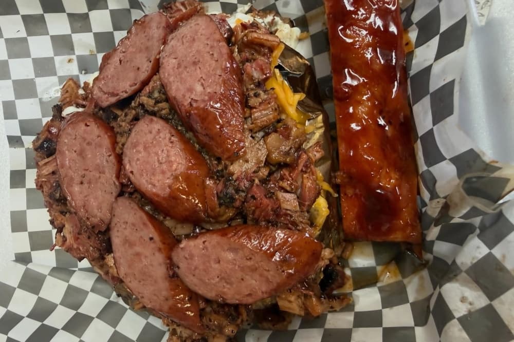 Pile of barbecued sliced sausage
