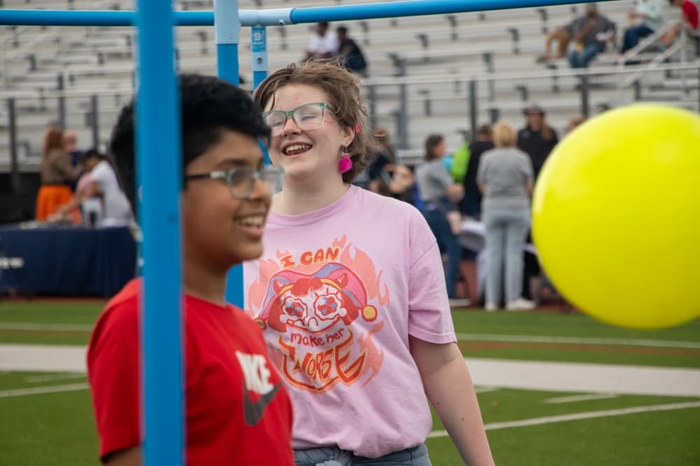 students smiling at allen isd's field day for everyone event