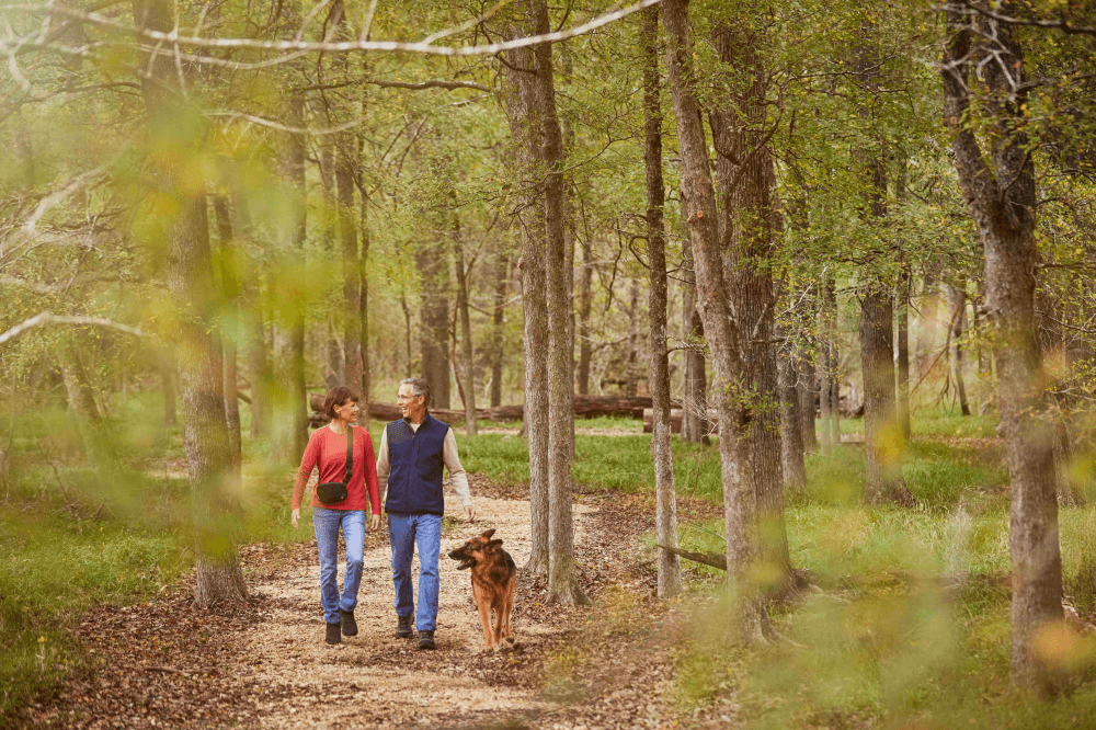 Residents enjoying outdoor trails and walking paths in Chambers Creek active adult community
