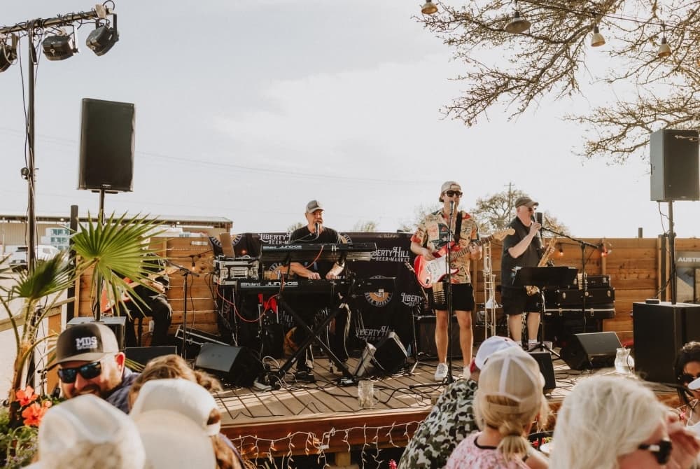 A band performs outdoors at Liberty Hill Beer Market