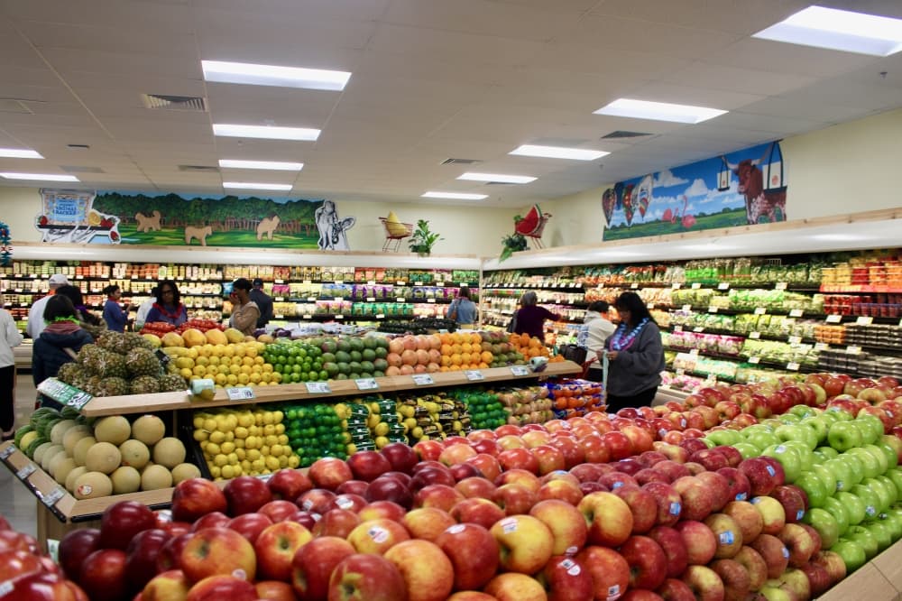 People shopping produce