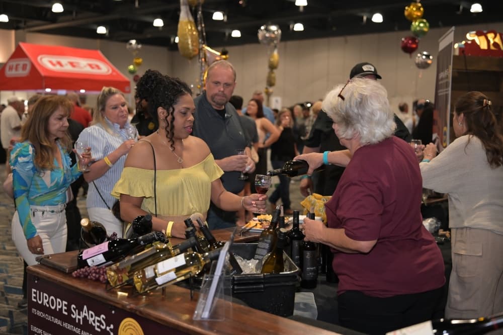 people enjoying wine at event