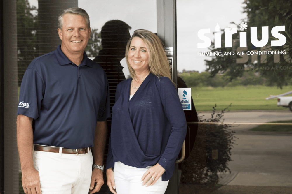 Sirius Plumbing & Air Conditioning technician servicing HVAC system in North Dallas home