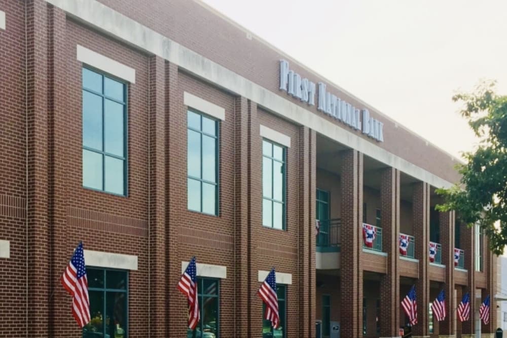 Bastrop residents could see expanded First National Bank services following acquisition