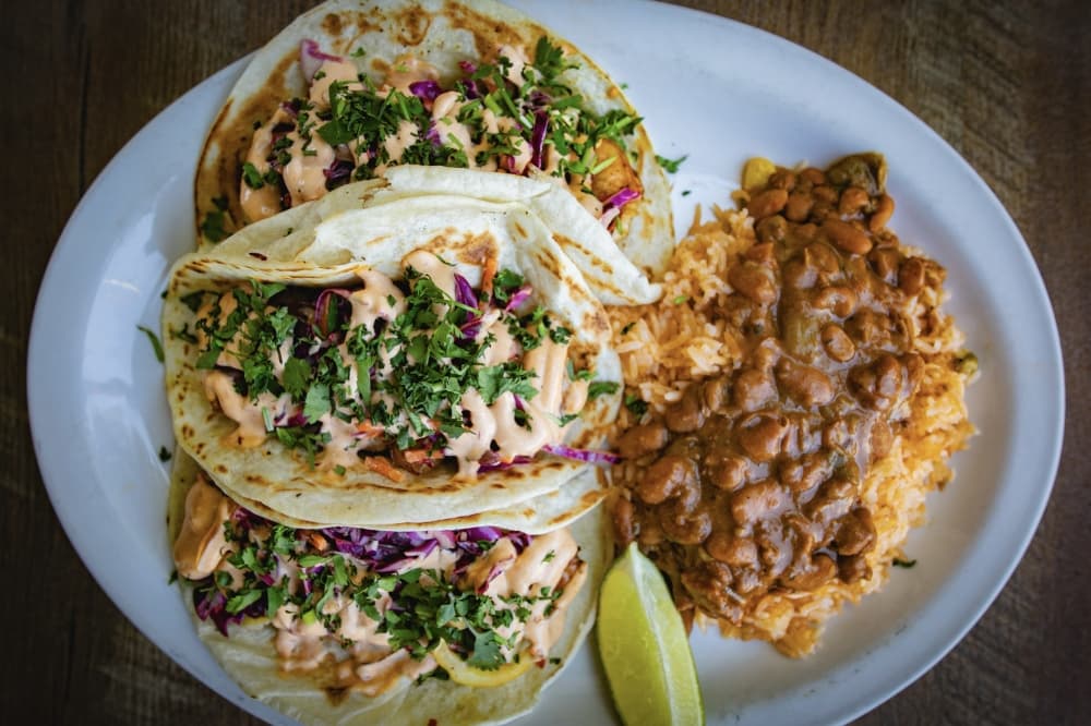 Ed's El Camino tacos includes crispy firsh ($22) or blackened shrimp ($25) with house slaw, chili-lime vinagrette, rice and pinto beans on corn or flour tortillas. (Courtesy Ranch 616)
