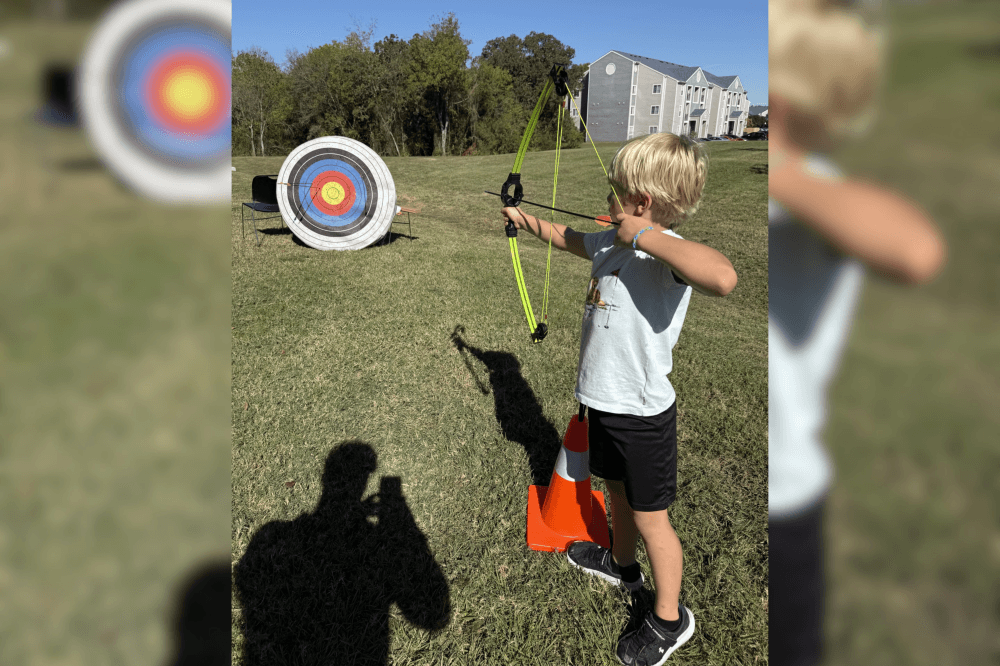 child doing archery
