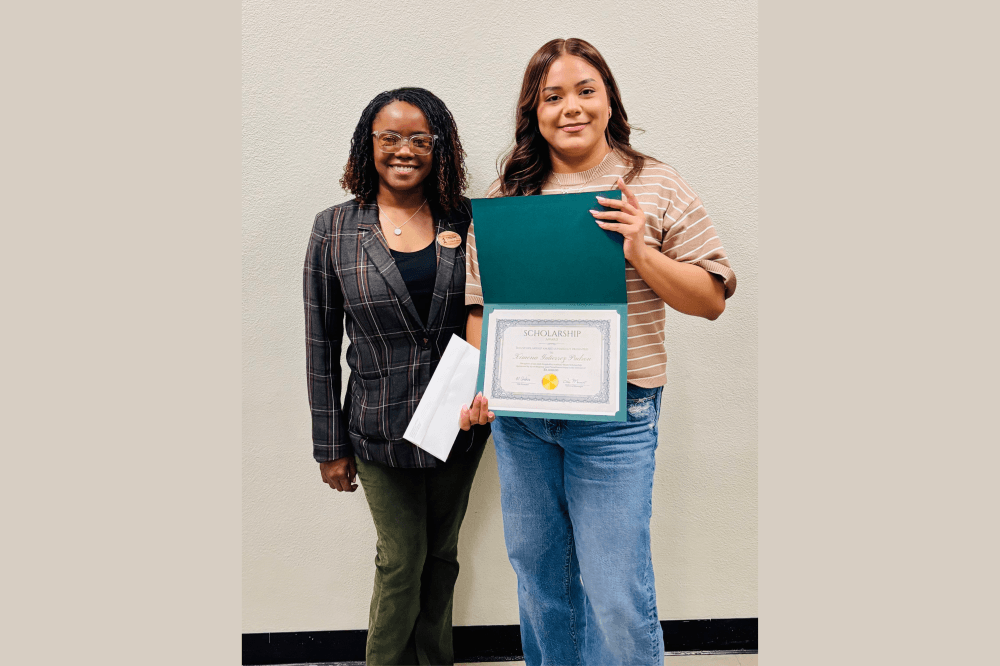 scholarship winner with her award