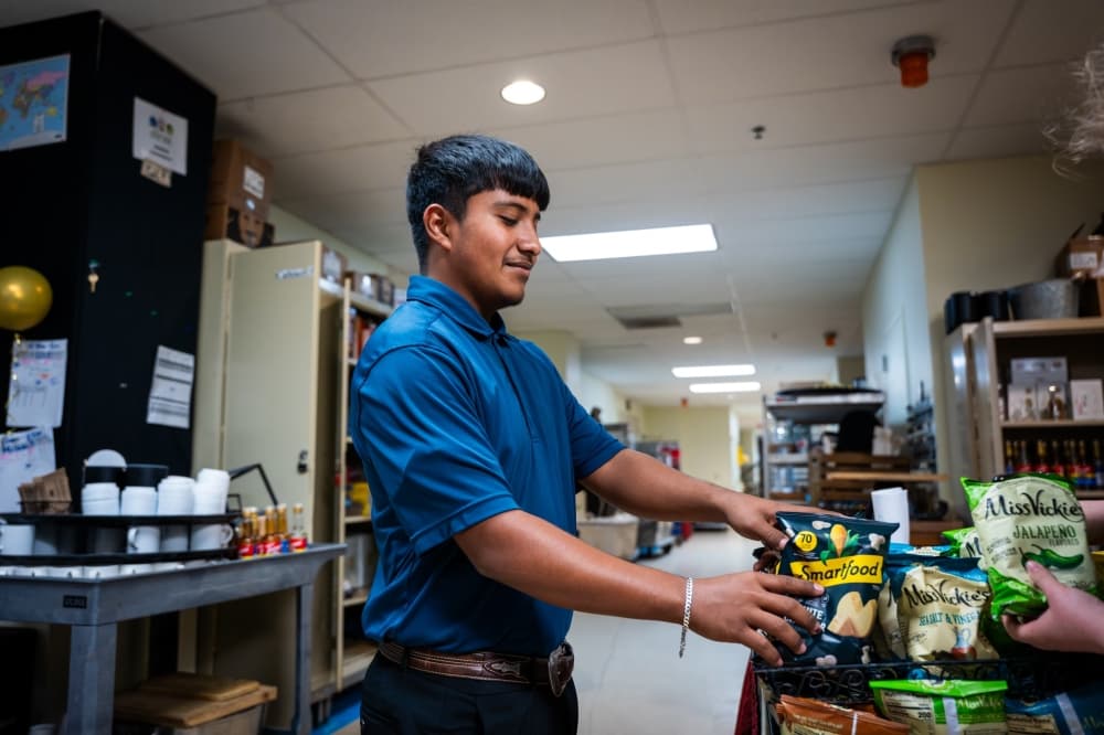 student stocking snacks