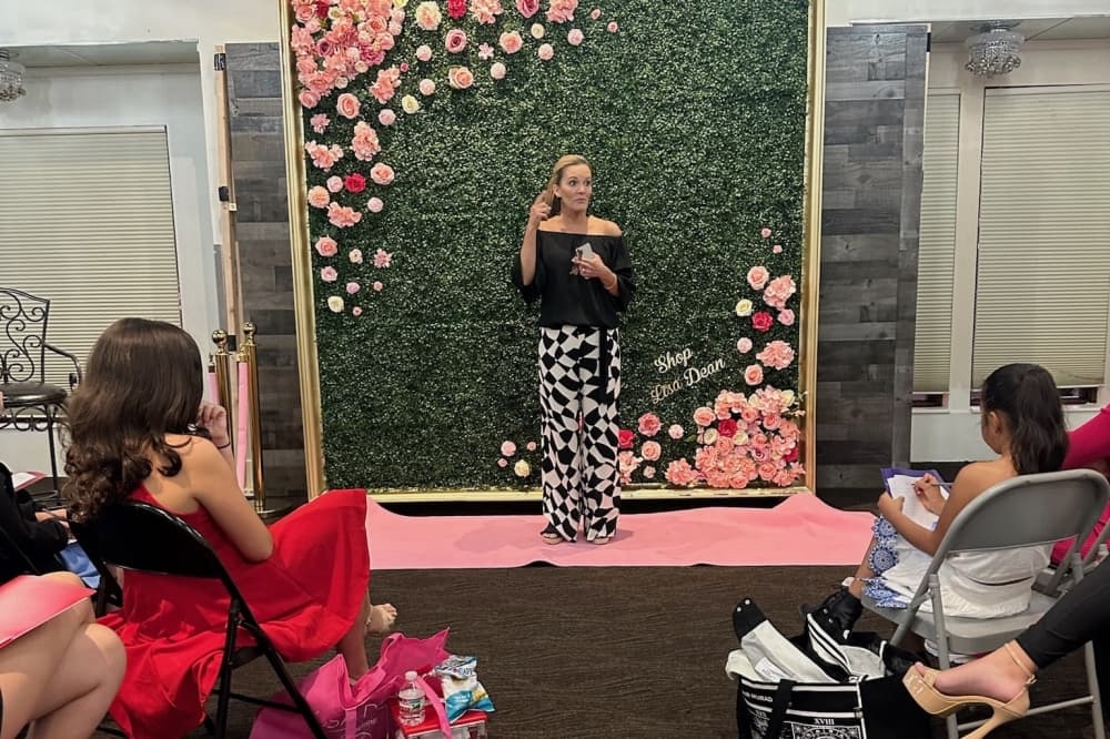 Lisa Dean presenting in front of young women