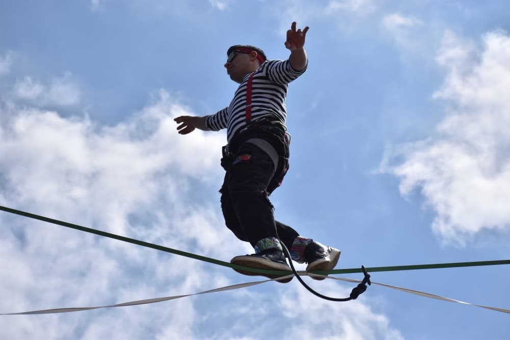 man walking on high-wire