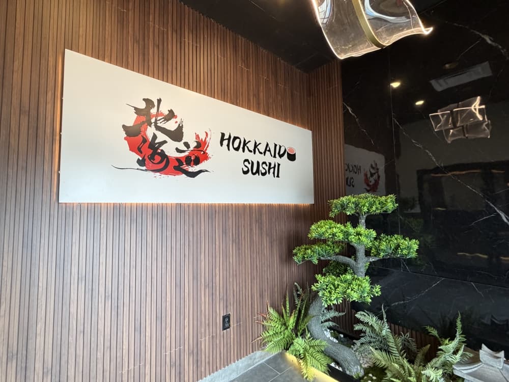 Hokkaido Sushi has a big brand sign inside the front door.