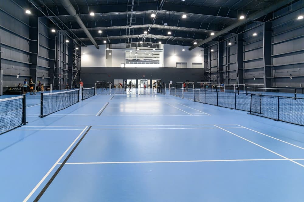 TopShot offers courts that are custom-built to meet the highest specifications for badminton and can also be used for pickleball. (Courtesy TopShot)