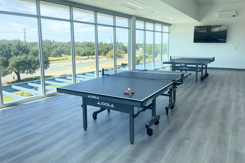 TopShot offers ping pong tables in addition to the badminton and pickleball facilities. (Courtesy TopShot)