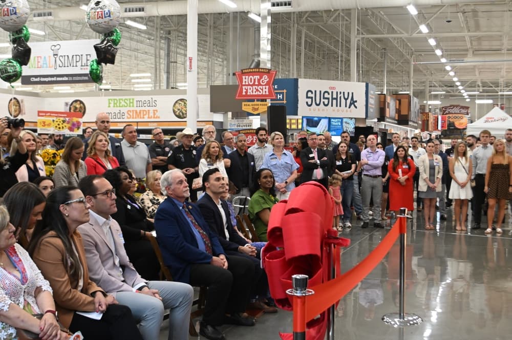 Local officials attend a ribbon cutting ceremony for a new H-E-B in Euless May 19.