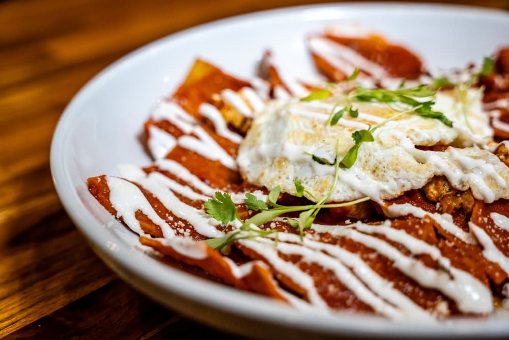 The chilaquiles at Purely Provisions comes with tortilla chips, salsa roja, chicken breast, egg, pico, queso cotija, sour cream and avocado. (Courtesy Purely Provisions)