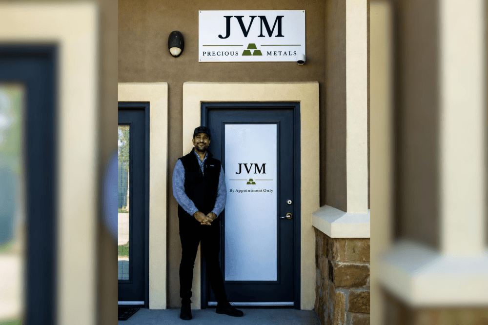 vinay pattni standing in front of store door
