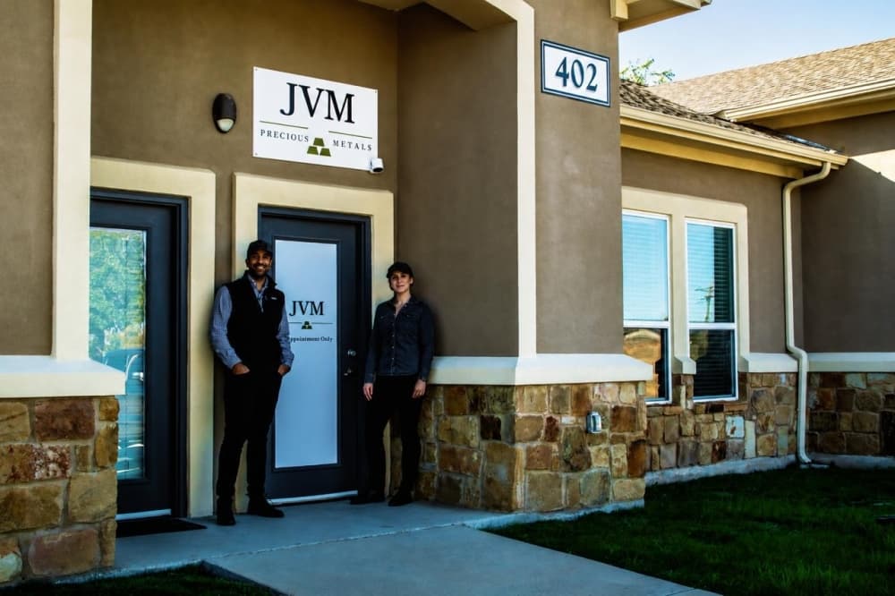 jvm precious metals owners posing in front of store