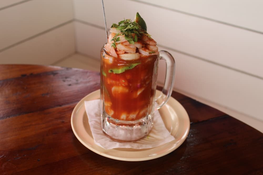 The shrimp cocktail house specialty features shrimp, diced avocado, red onion, tomato, cilantro and serrano peppers. (Michael Crouchley/Community Impact)