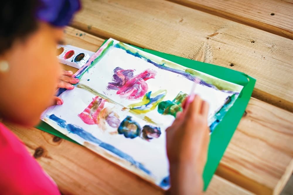 child doing artwork