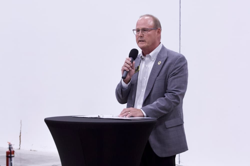 a man speaking at a podium