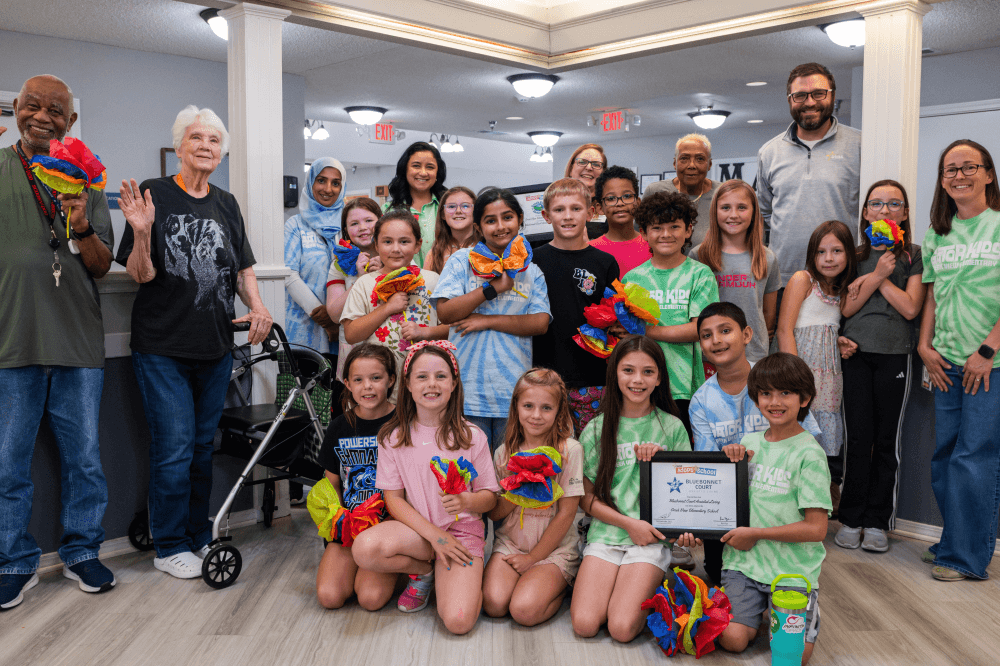 Teacher supporting elementary students at Creek View Elementary School in College Station TX