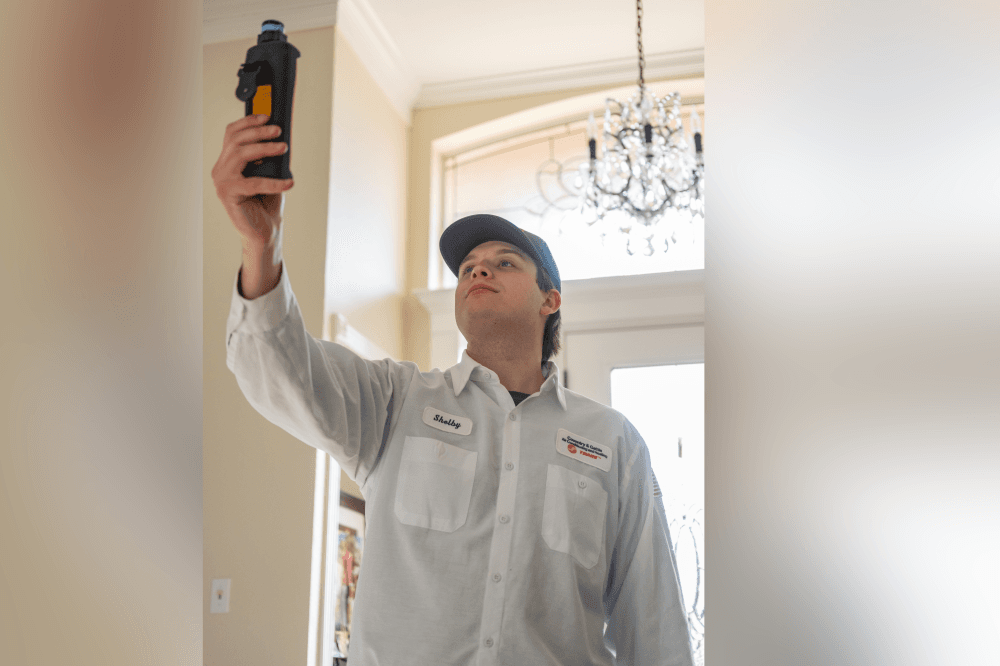 Coventry & Gattis technician explaining HVAC repair options to a homeowner during a residential service appointment in Grapevine.