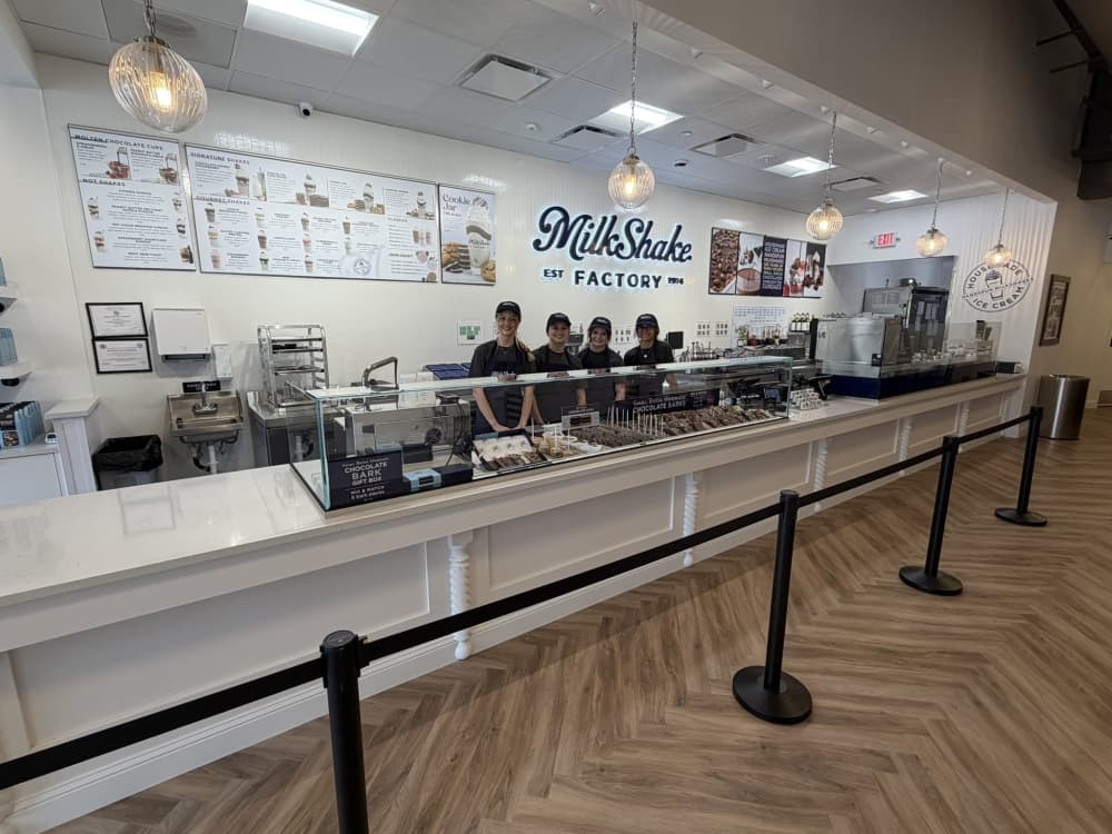 employees at a MilkShake Factory counter