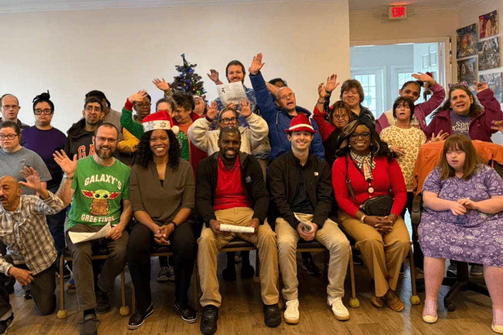 Clients pose for photo at Special Angels facility