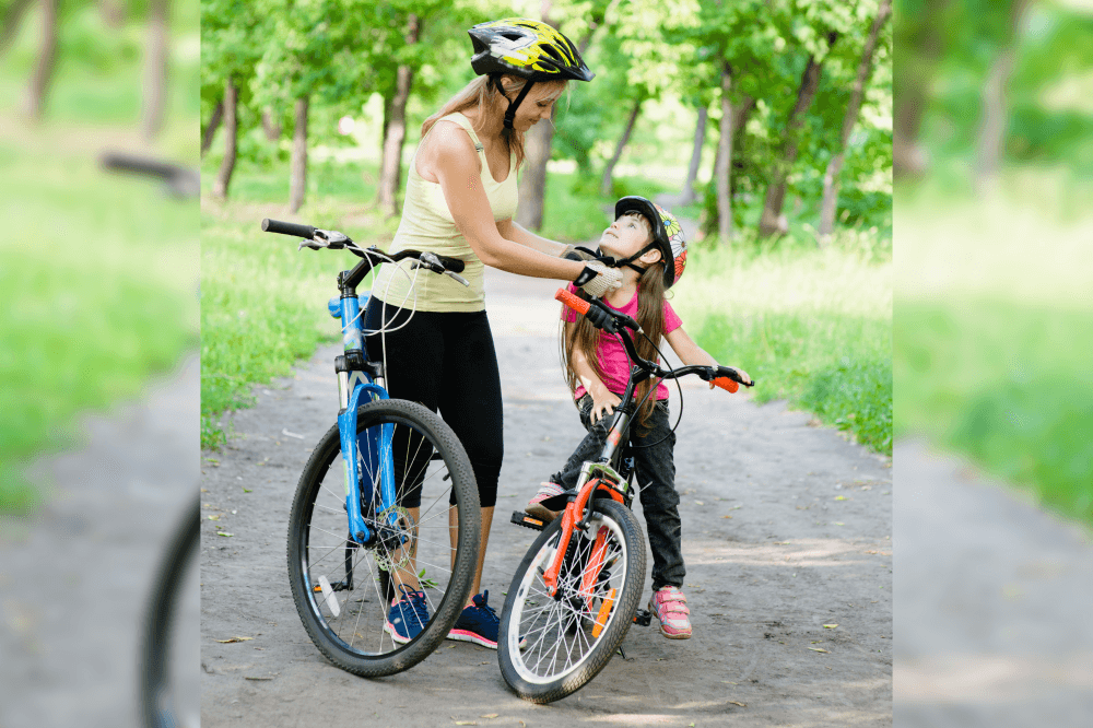 mom and daughter on a bike trail in frisco