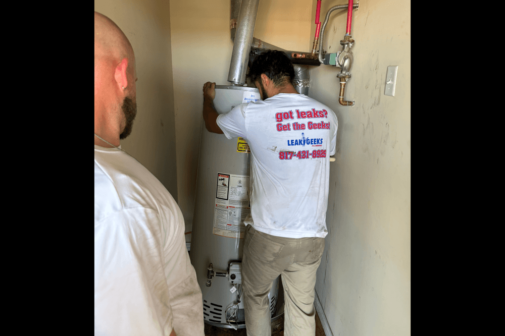 dfw plumber fixing water heater