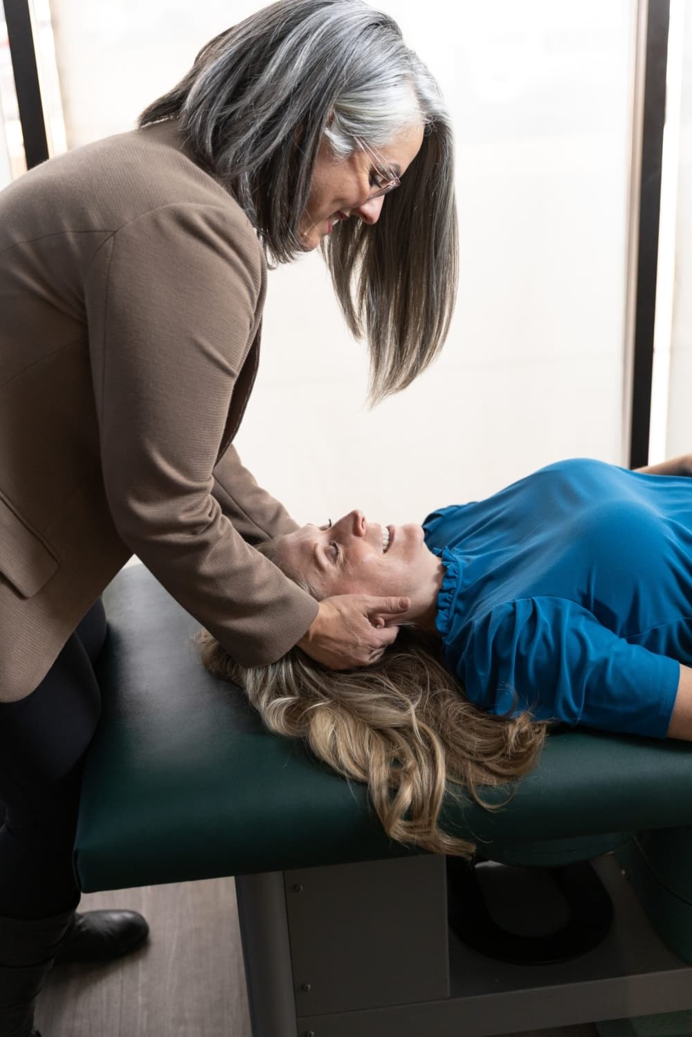 Lauren Baker, owner of New Leaf Chiropractic in Kingwood, performs chiropractic services on a patient. (Courtesy New Leaf Chiropractic) 