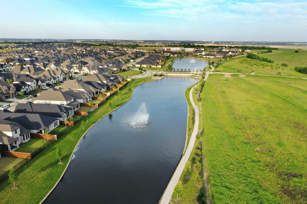 photo of a neighborhood with a lake in celina