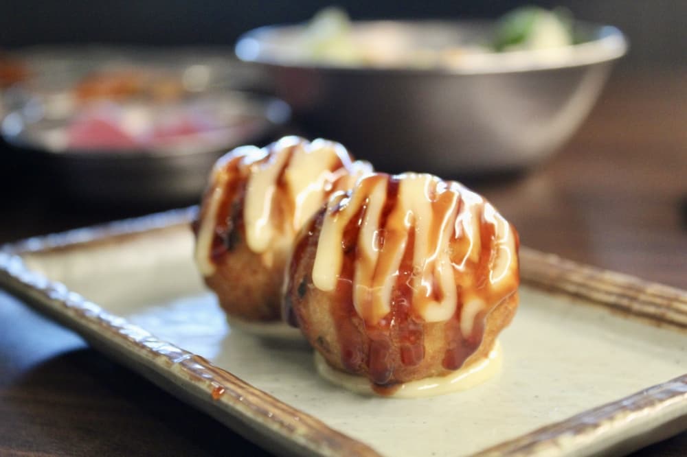 The sesame rolls are a side dish offered at Gangnam BBQ & Sushi. (Jovanna Aguilar/Community Impact)