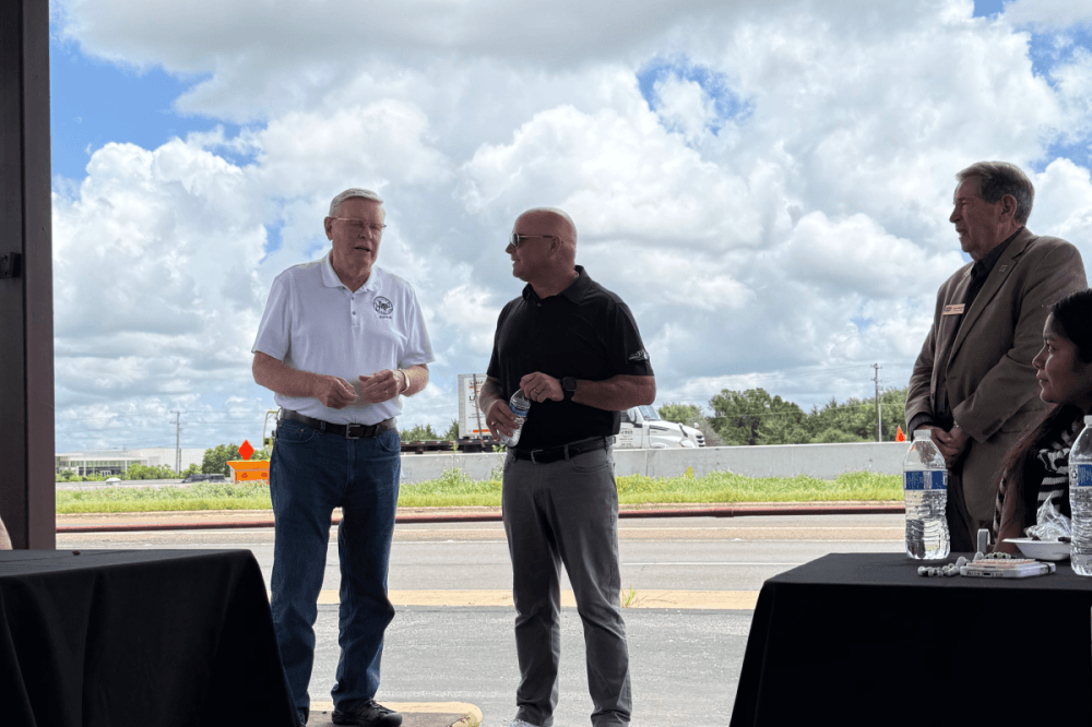 D&D owner, Dan Daniel, receives a congratulations for 25 years of operation from College Station Mayor John Nichols. (Lana Spacek, Community Impact)