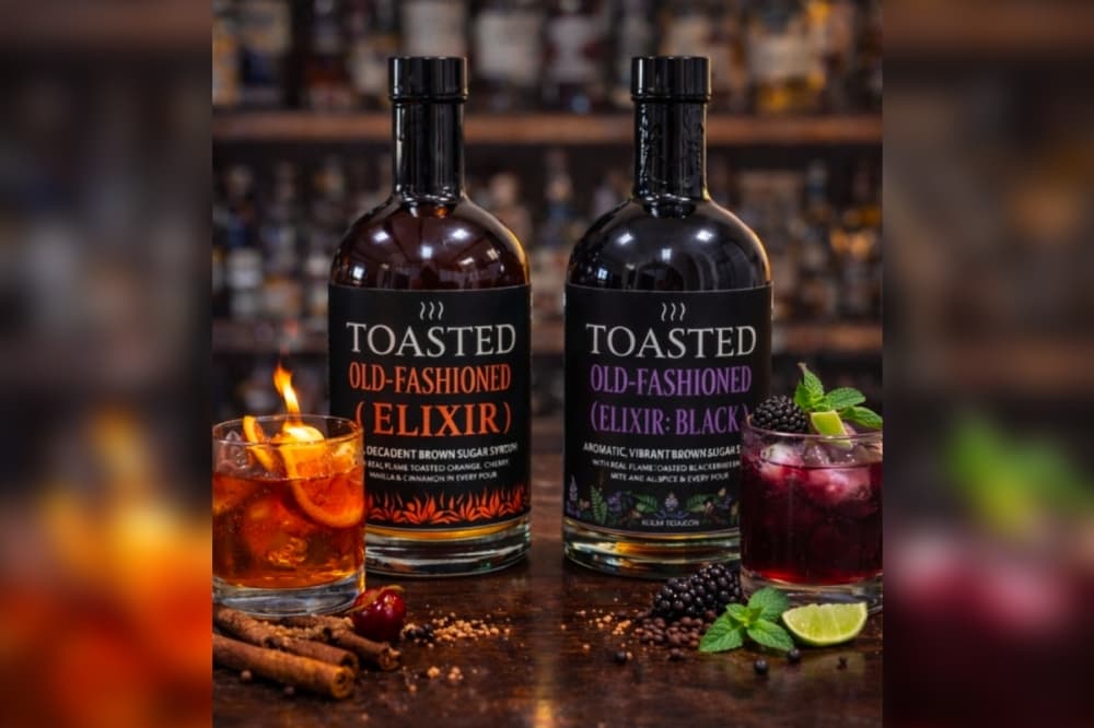 Bottles of simple syrup and dirnks