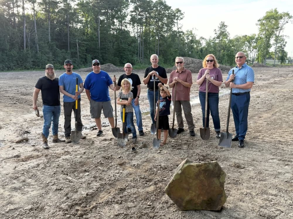 The Dwelling officials posed with shovels on the new property