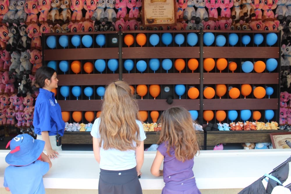 Universal Kids Resort visitors play a game at the Puss in Boots Del Mar on June 18. The park opens July 1. (Samantha Douty/Community Impact)