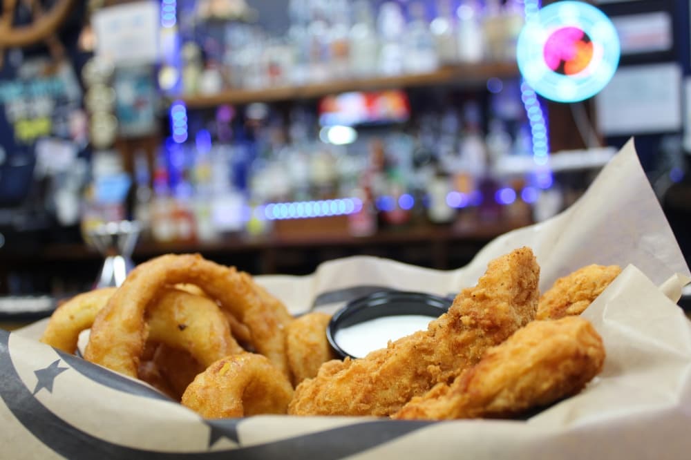 The chicken tenders ($13.99-$14.55) are lightly breaded and served with fries, tater tots or onion rings. (Jovanna Aguilar/Community Impact)