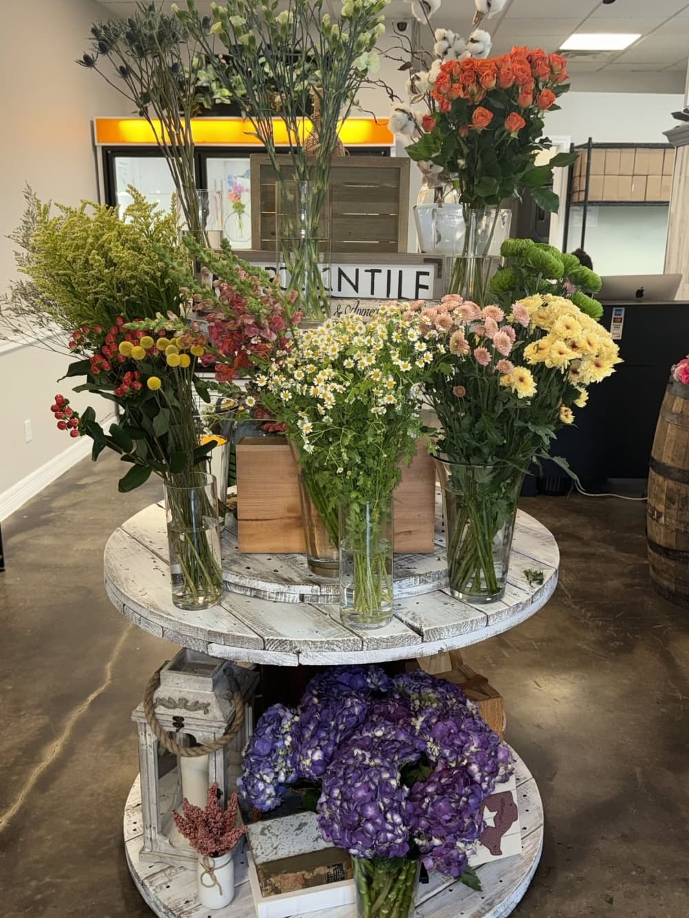 Shelves of flower bouquets inside Splendid Arrays Flower Shop